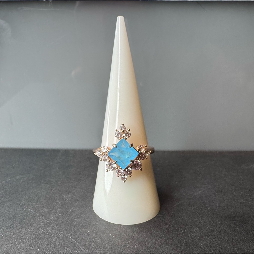 Elegant London Blue and White Topaz on a  dipped yellow gold band Ring